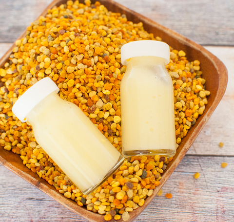 Jars of Royal Jelly Jars on Top of Bee Pollen